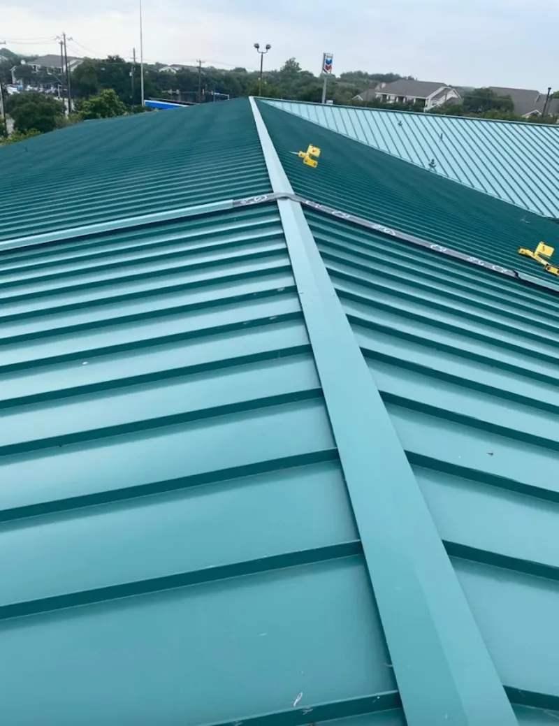 Green commercial metal roof ridge and valley for Metal Roof Repair in Sartell