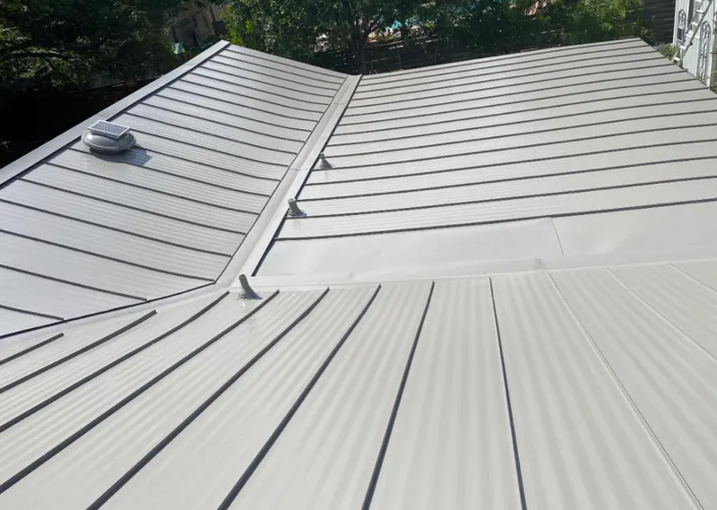 Solar attic fan installed on a metal roof for Roof Ventilation in Sartell